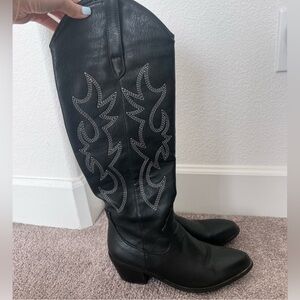 Tall black cowboy boots